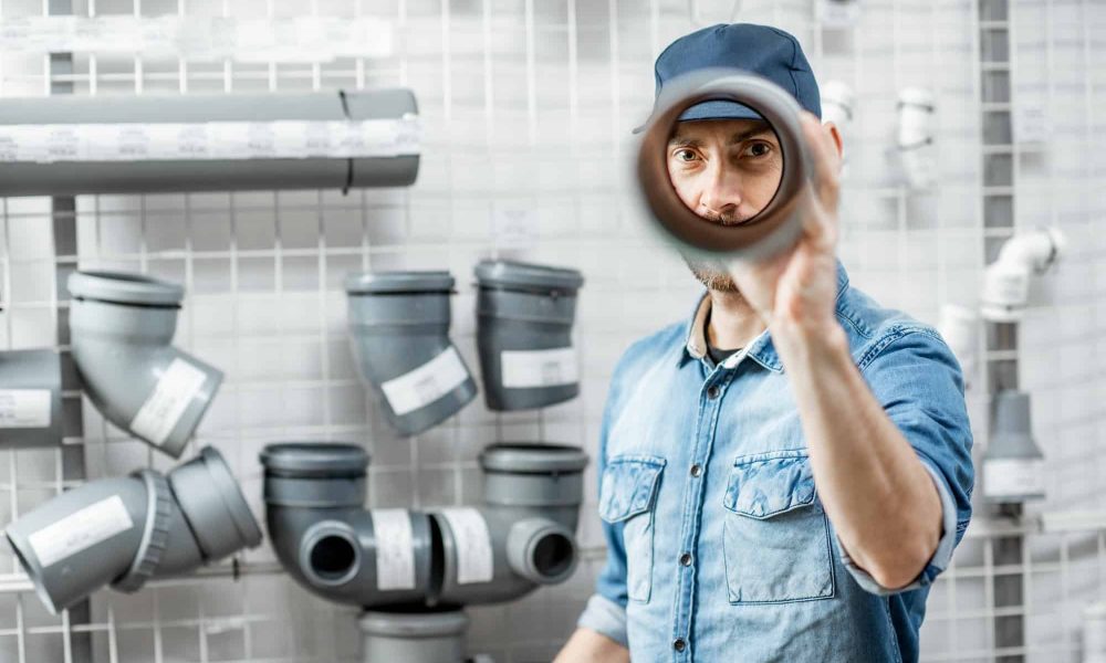 man-choosing-pipes-in-the-plumbing-shop-2.jpg